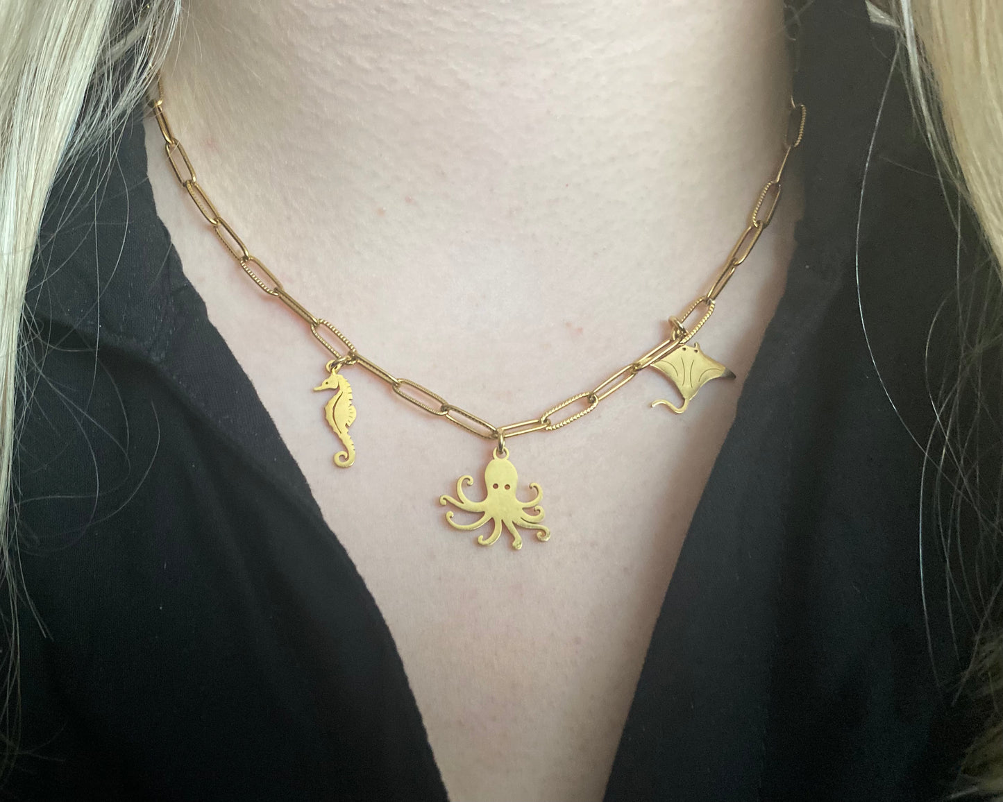 RVS goudkleurige schakelketting met 3 zee bedels